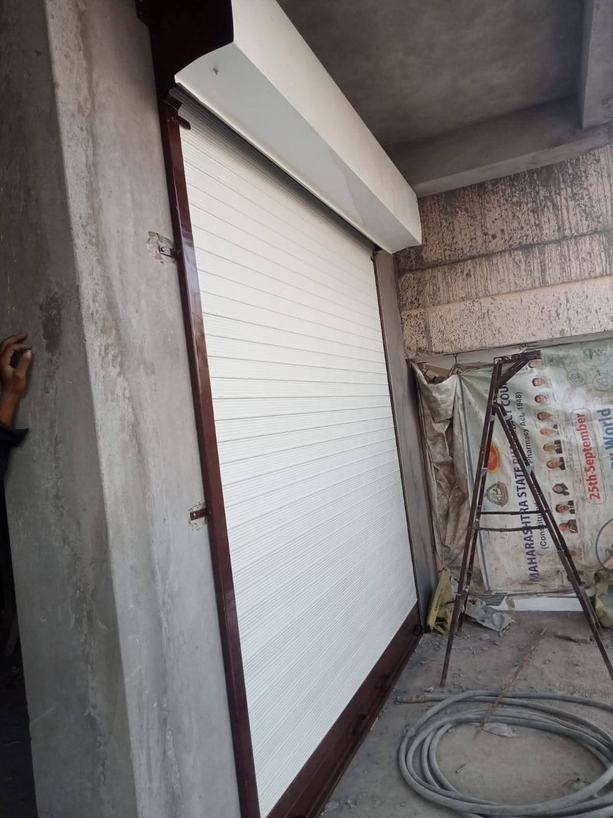 Cream finish rolling shutter installation, Nagpur