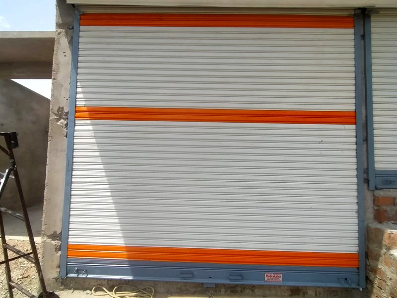 Orange stripe powder coated rolling shutter installation, Nagpur