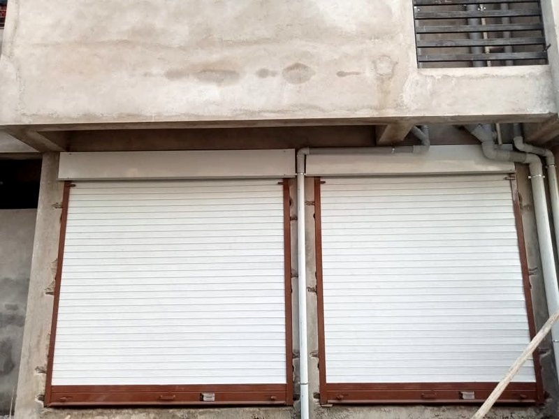 Residential site par twin white rolling shutters, Nagpur